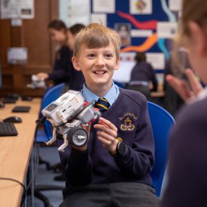 student showing another student their robot creation