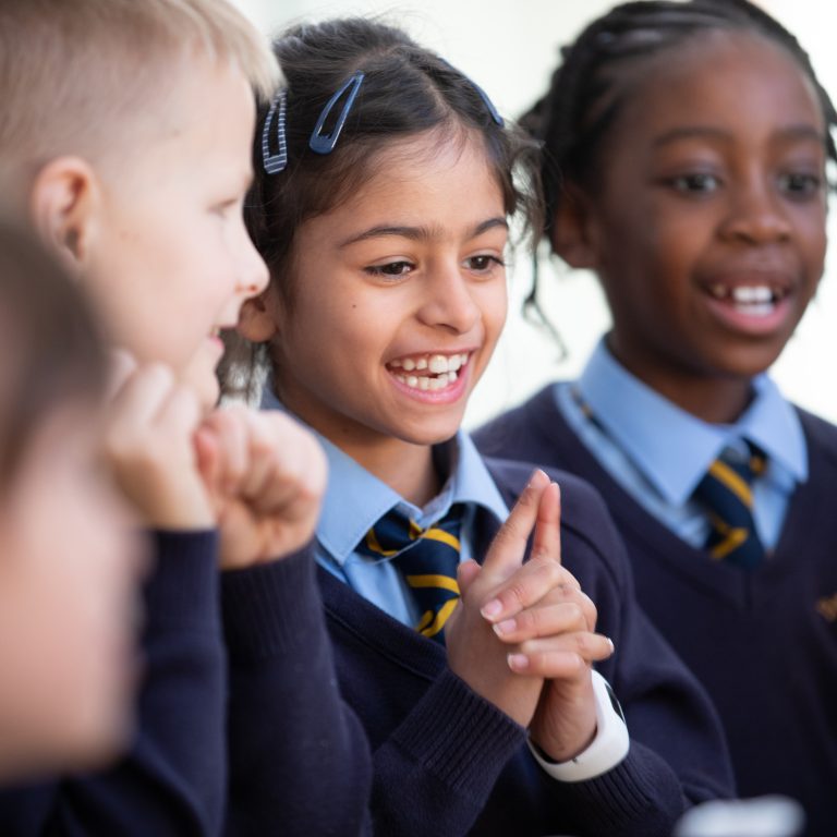 child with fingers pressed together