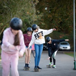 girls skating on the road