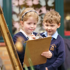 pupil holding a clipboard