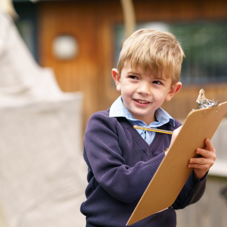 pupil holding a clipboard