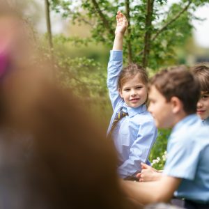 student raising hand