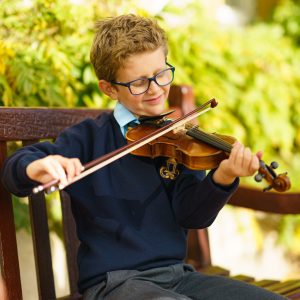 student playing viola