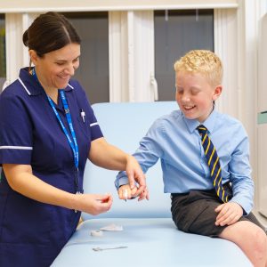 student receiving care from a nurse