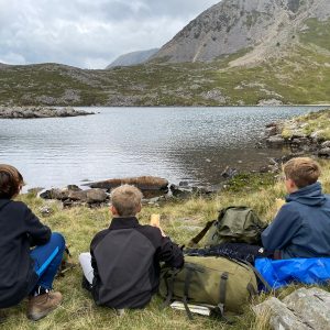 3 students looking out to the view