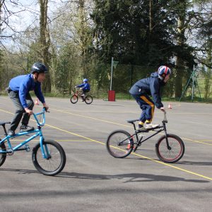 students playing on BMX bikes