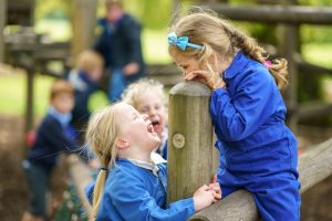 children smiling at each other and having fun