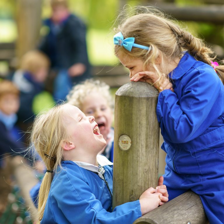 children smiling at each other and having fun