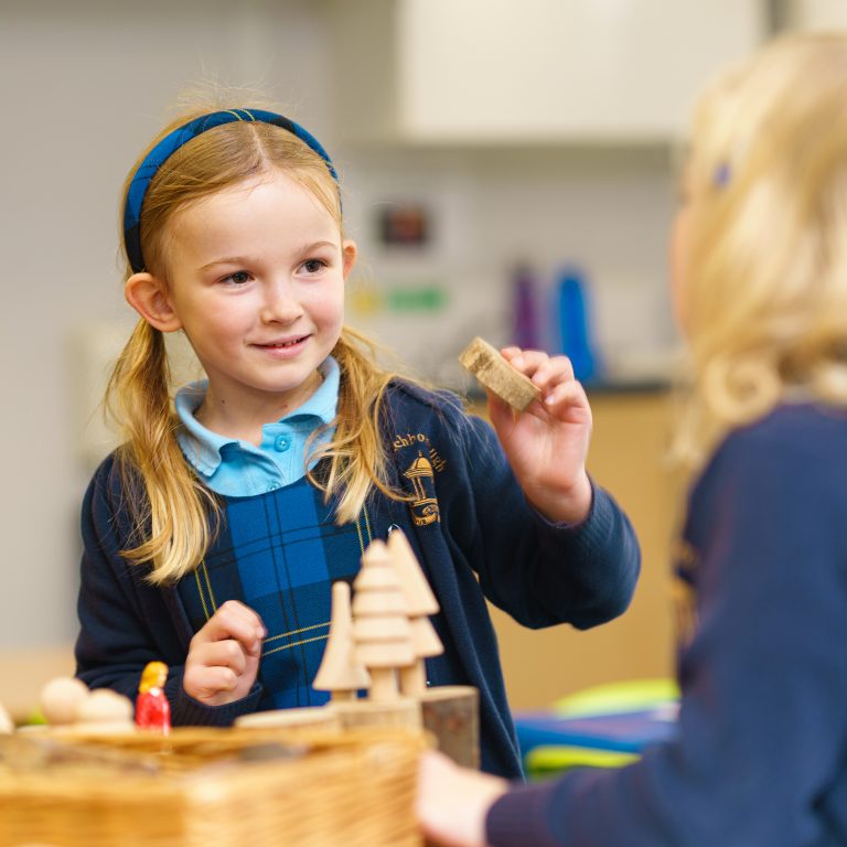 a child using wooden pieces to play