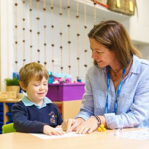 boy working with his teacher