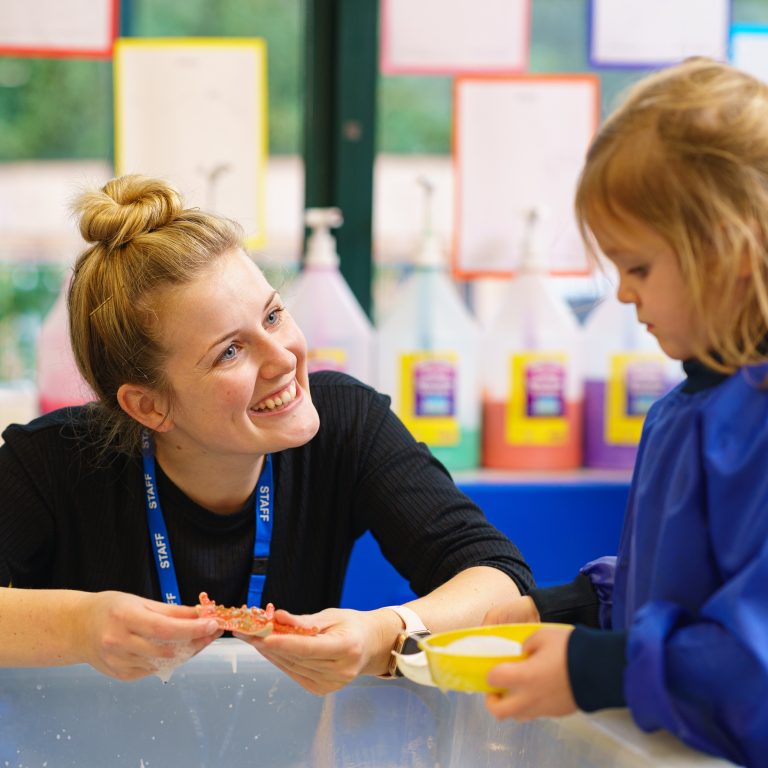 teacher interacting with her student