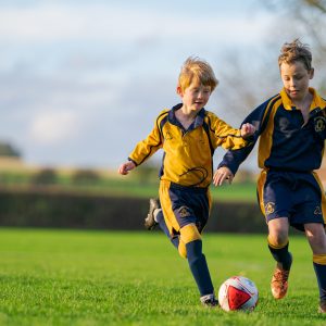 2 students playing football