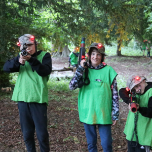 students holding paintball guns