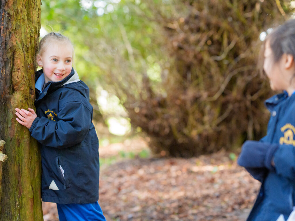 Girls playing in the woods