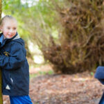 Girls playing in the woods
