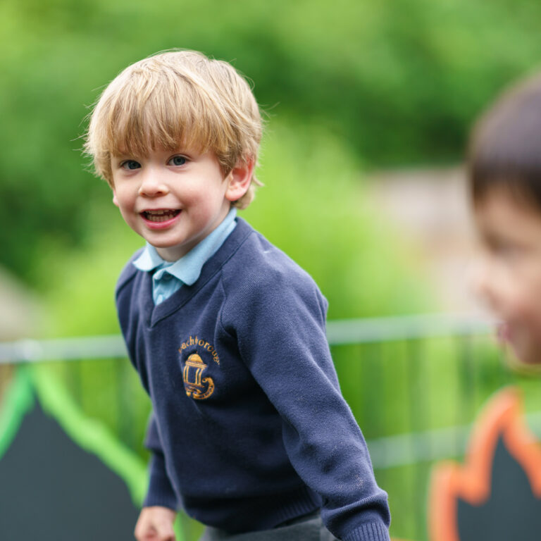 Enjoying nursery outdoor play area
