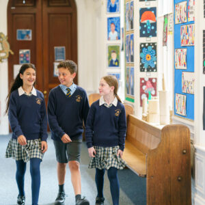 Form 7 wellbeing ambassadors walking along manor house corridor